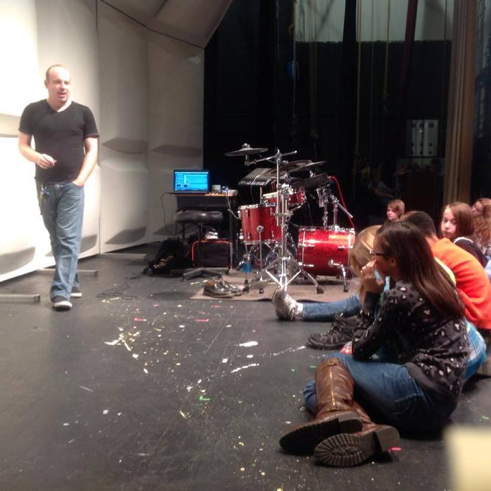 Adam lecturing students at Chattanooga high school, center for create arts